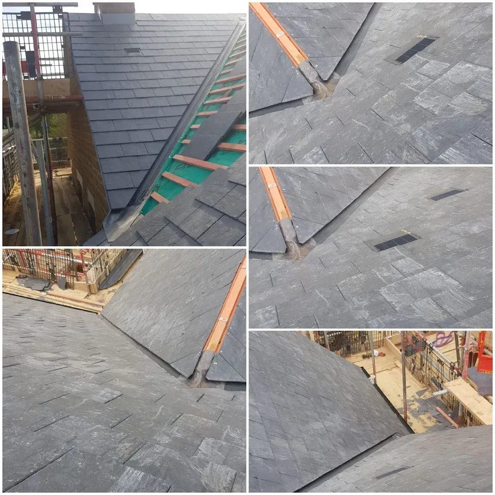 Natural slate roof being laid, showing membrane and battens, slated valleys and slate roof vents